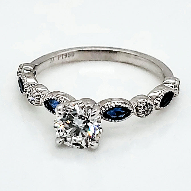 Platinum .71 Carat Diamond Engagement ring With Diamond and Sapphire Mounting