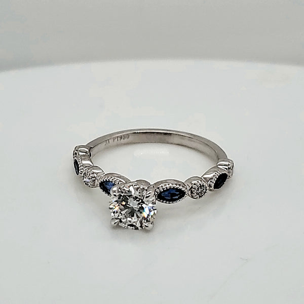 Platinum .71 Carat Diamond Engagement ring With Diamond and Sapphire Mounting