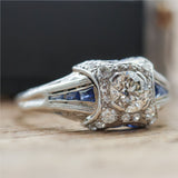 Art Deco Platinum .60 Carat European Cut Diamond and Sapphire Engagement Ring