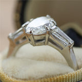 1.91Ctw Platinum Three Stone Oval Diamond And Baguette Engagement Ring