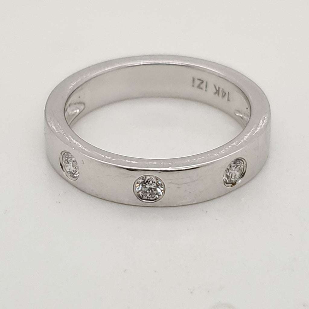 14kt white gold bezel set diamond band.