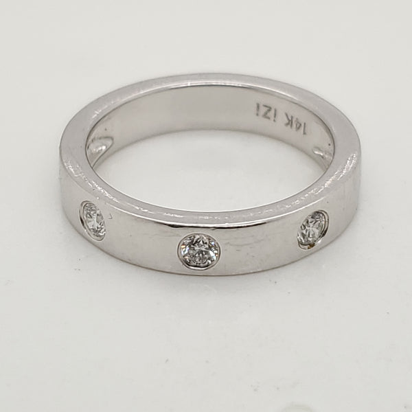 14kt white gold bezel set diamond band.