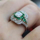 Art Deco Inspired Platinum Asscher Cut Diamond and Emerald Ring