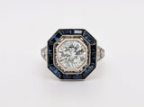 Platinum and Diamond Ring with Blue Sapphire Halo