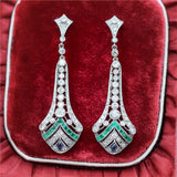Modern Art Deco Style Platinum Diamond Emerald and sapphire Dangle Earrings