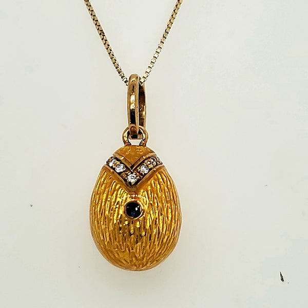 Signed and Numbered 18kt Yellow Gold Yellow Enamel Diamond Sapphire and Ruby Egg Pendant