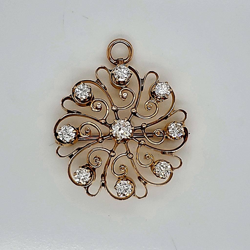 Vintage 14kt gold and diamond starburst brooch/pendant