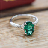 18kt White Gold 1.80Ct Oval Green Emerald And Diamond Ring