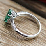 18kt White Gold 1.80Ct Oval Green Emerald And Diamond Ring