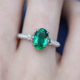 18kt White Gold 1.80Ct Oval Green Emerald And Diamond Ring