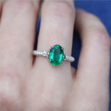 18kt White Gold 1.80Ct Oval Green Emerald And Diamond Ring