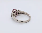 Platinum Ring with Oval Ruby and Round Brilliant Diamonds