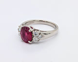 Platinum Ring with Oval Ruby and Round Brilliant Diamonds