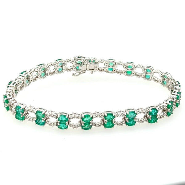 14kt white gold Emerald and Diamond bracelet.