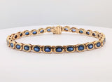 14K Yellow Gold Tennis Style Bracelet with Bezel Set Royal Blue Oval Sapphires