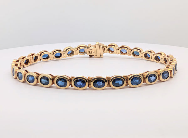 14K Yellow Gold Tennis Style Bracelet with Bezel Set Royal Blue Oval Sapphires