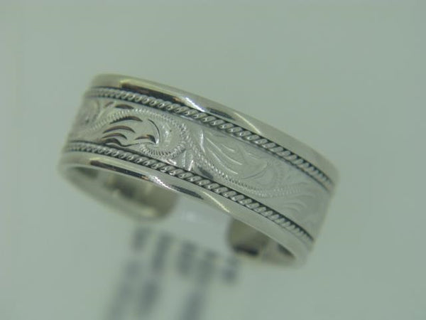 14kt white gold Gents Novell wedding band.