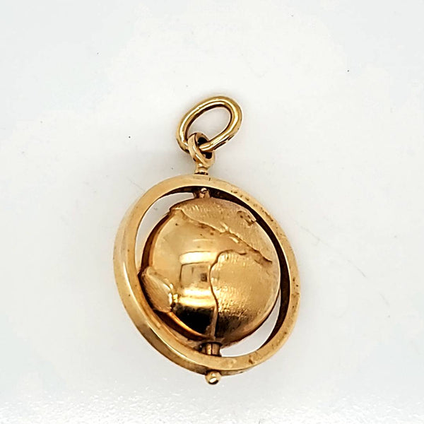 Vintage 18kt yellow gold globe travel marker pendant