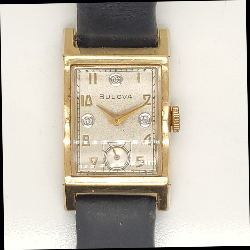 Vintage 14Kt Yellow Gold and Diamond Bulova Tank Watch.